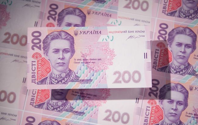 МВФ тисне на Україну: Bloomberg дізнався, чому фонд хоче девальвації гривні